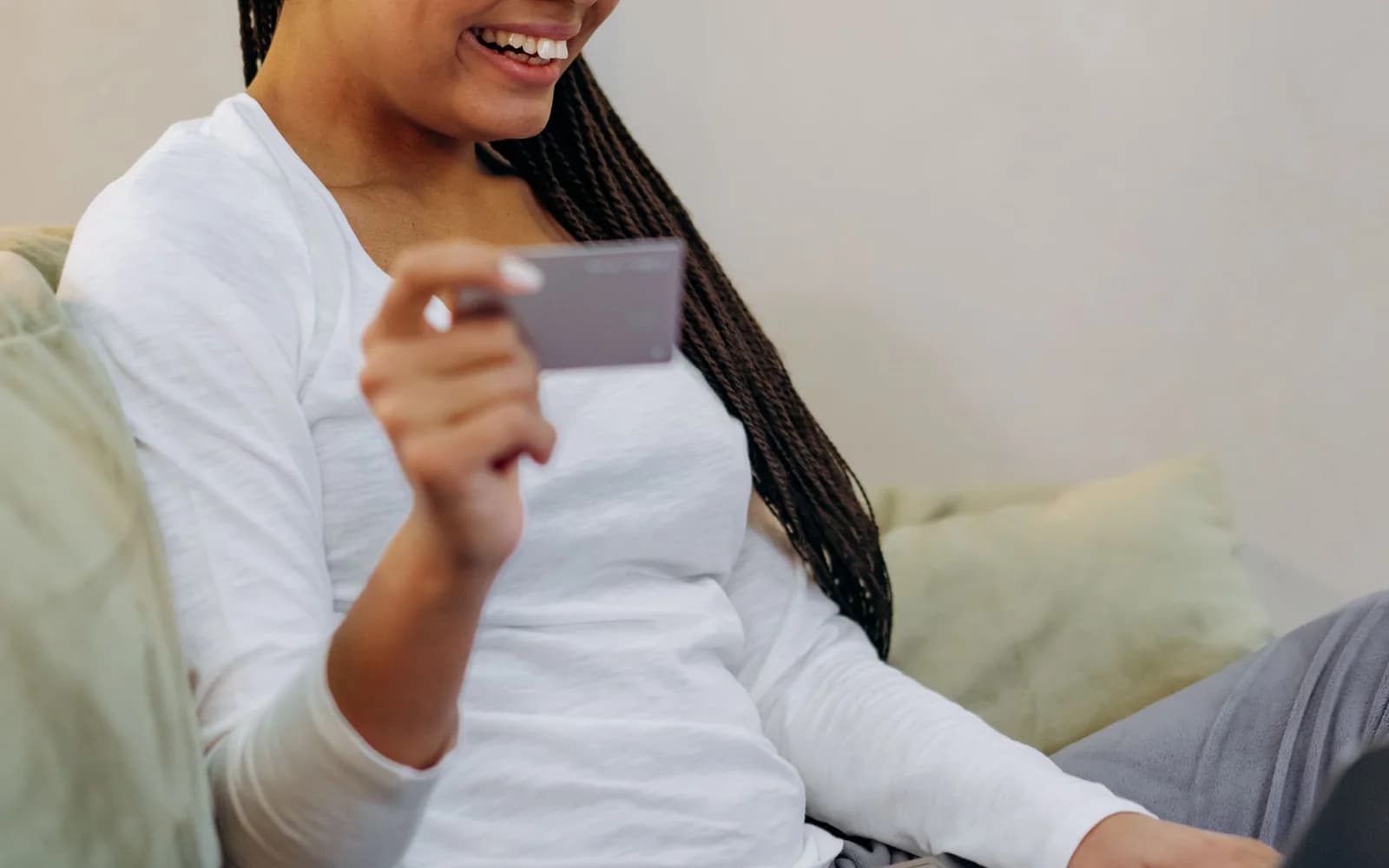 Editorial photograph: A Woman Doing Business Transaction Online Using a Laptop and Credit Card