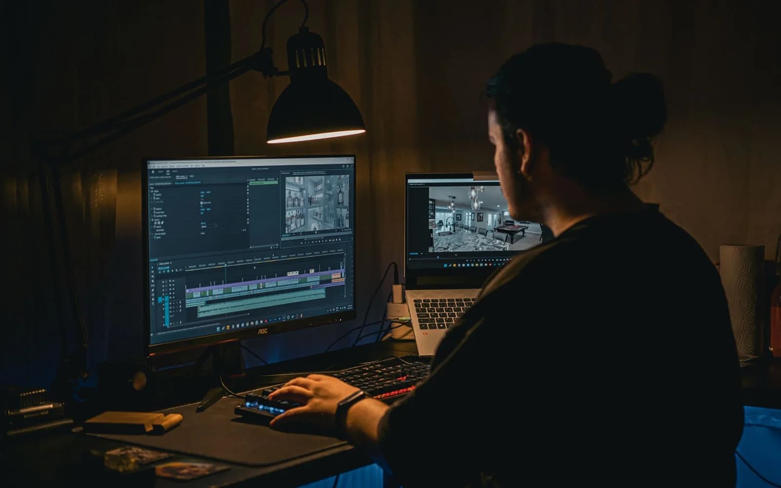 Editorial photograph: Video Editor Working in Dark