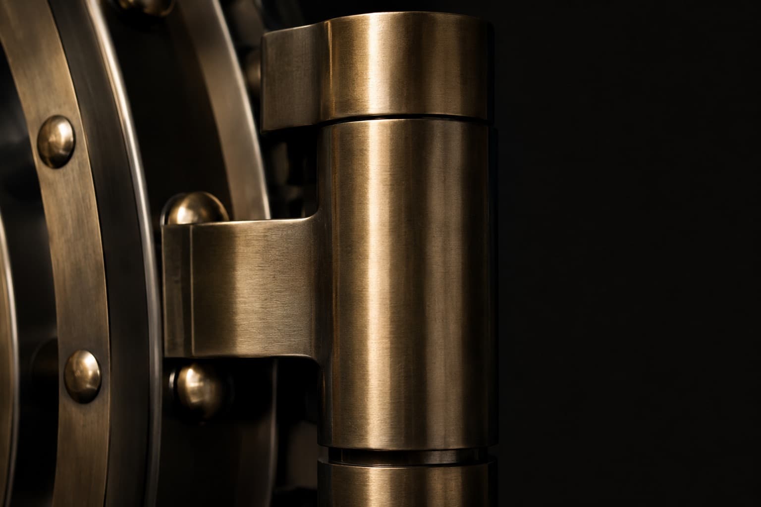 Close-up of a brass bank vault bolt against a dark background