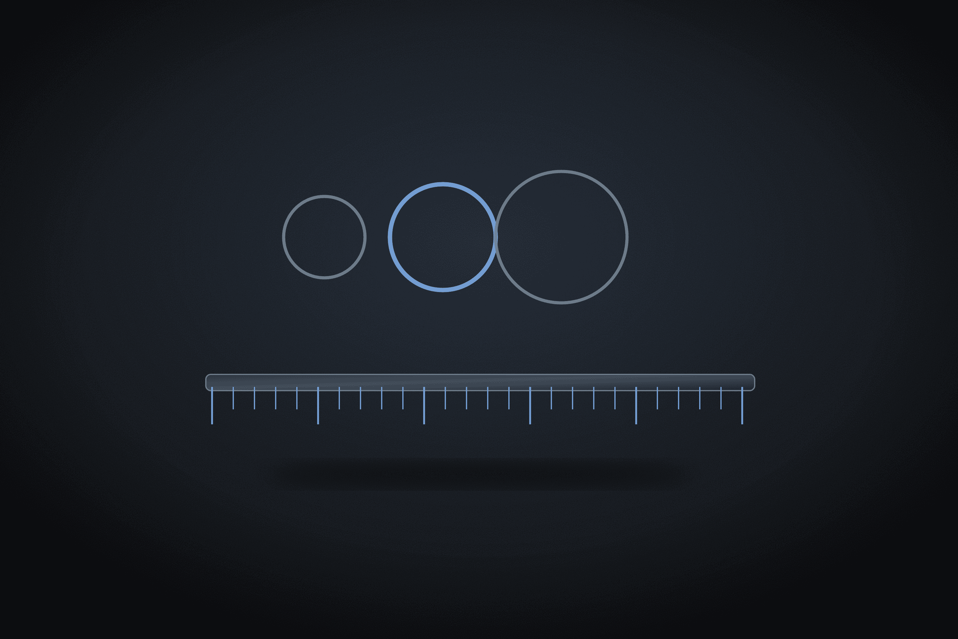 Row of rings of increasing size above a measuring ruler